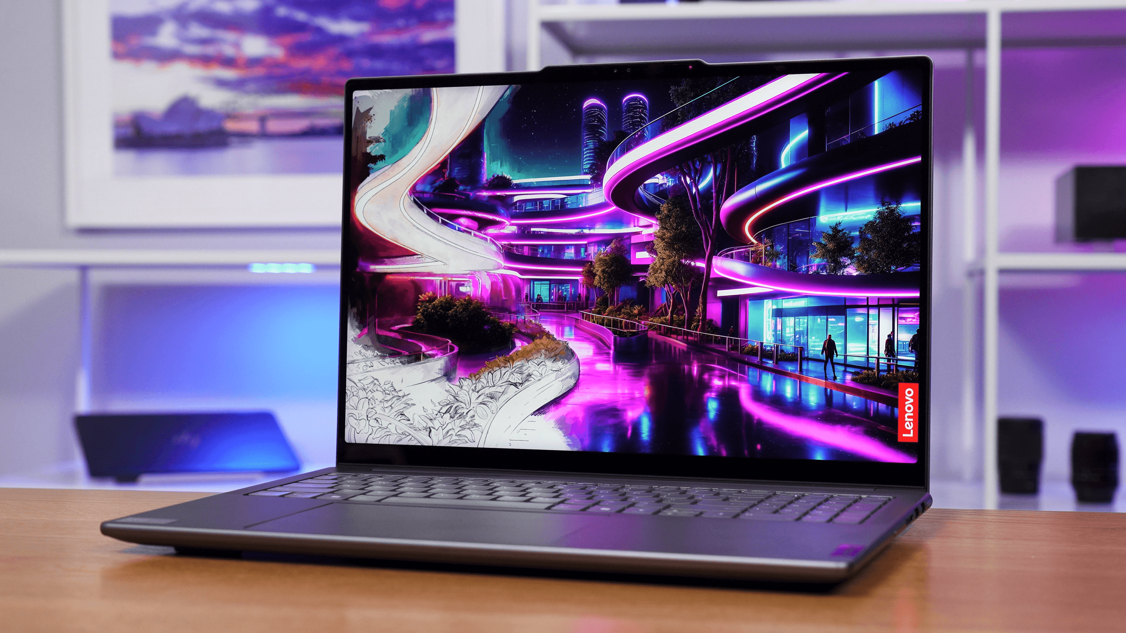 Lenovo Yoga Pro 9i with its lid open and display showing a futuristic cityscape